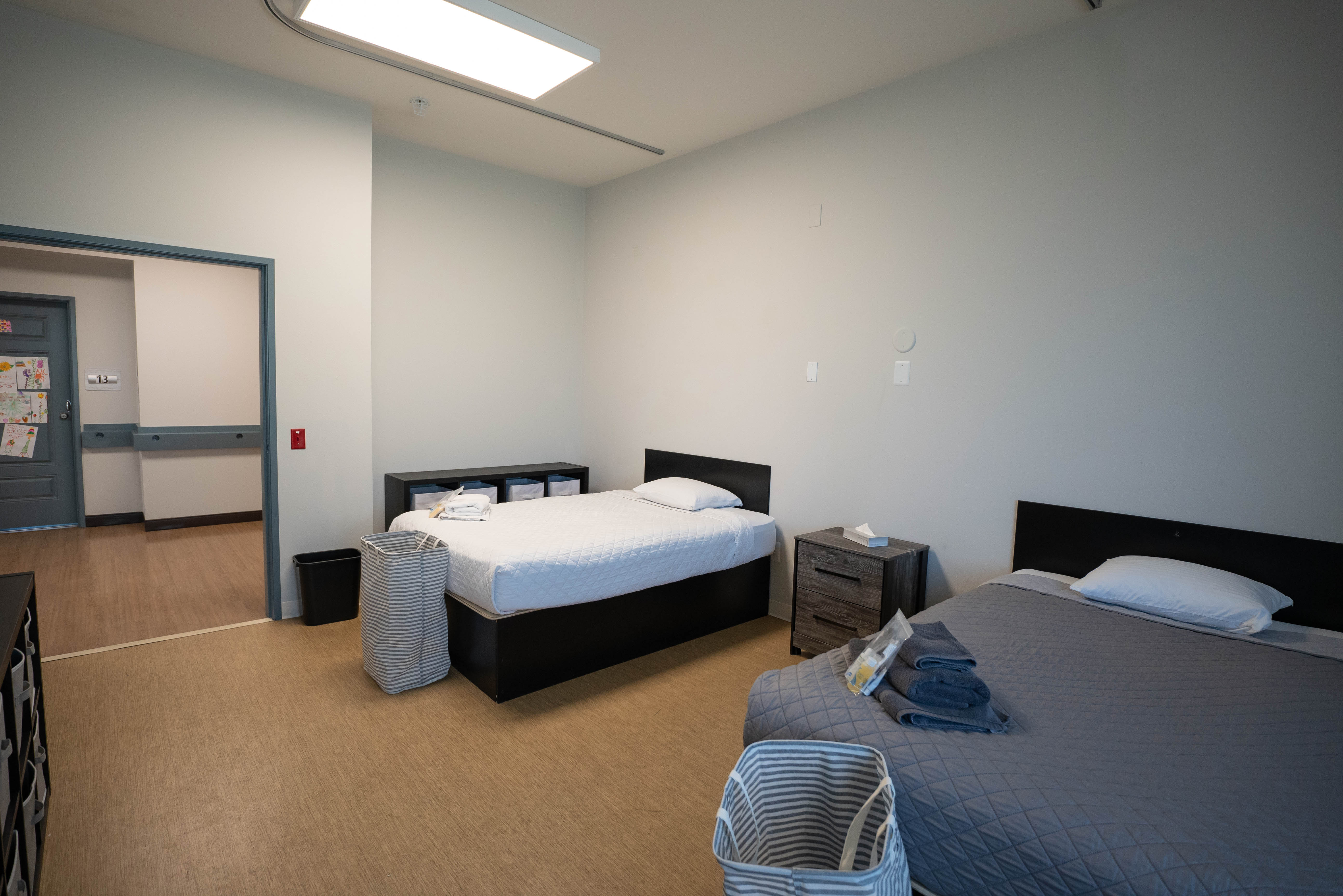 Silver State shared bedroom with two beds and storage