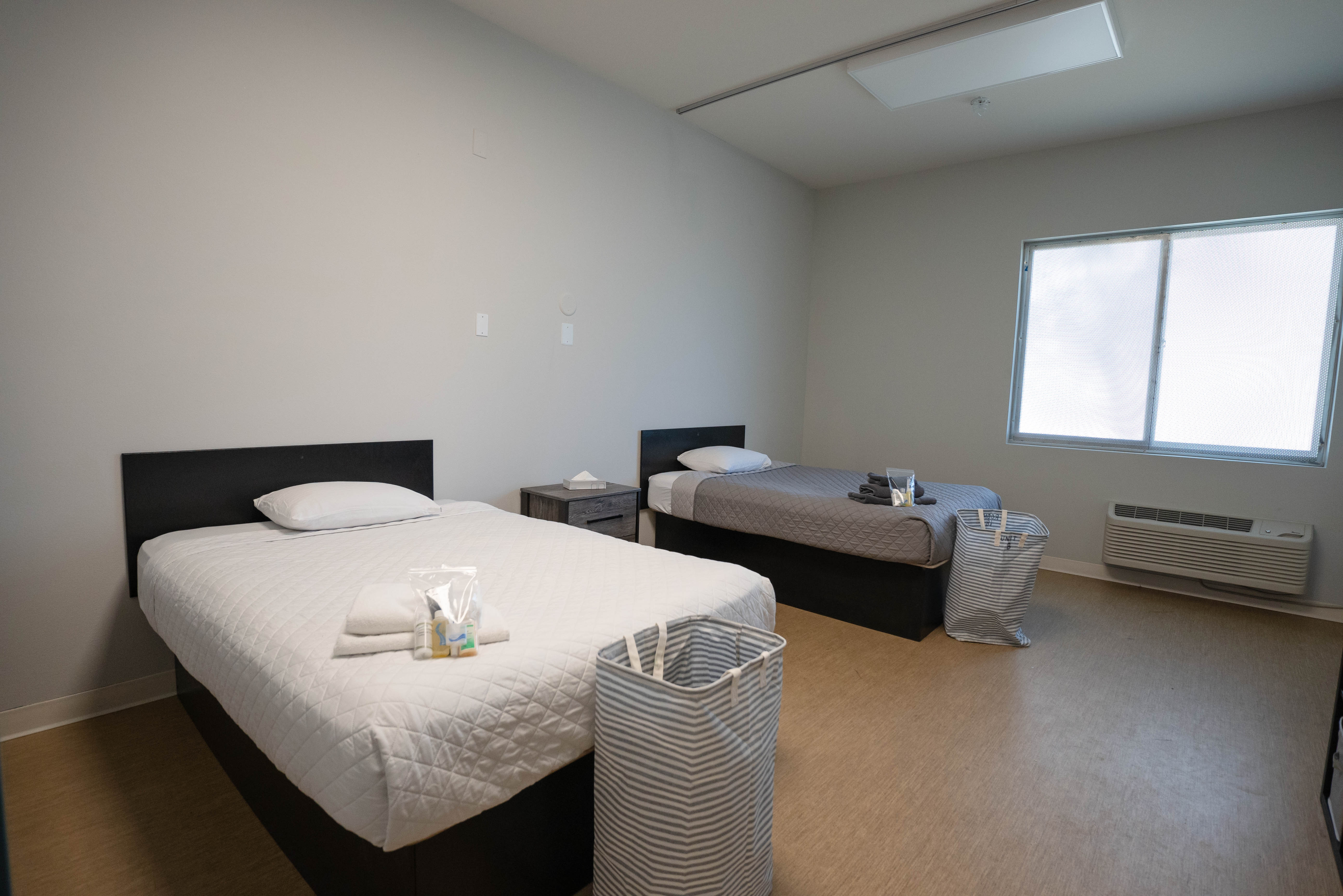 Silver State bedroom wide angle with welcome amenities