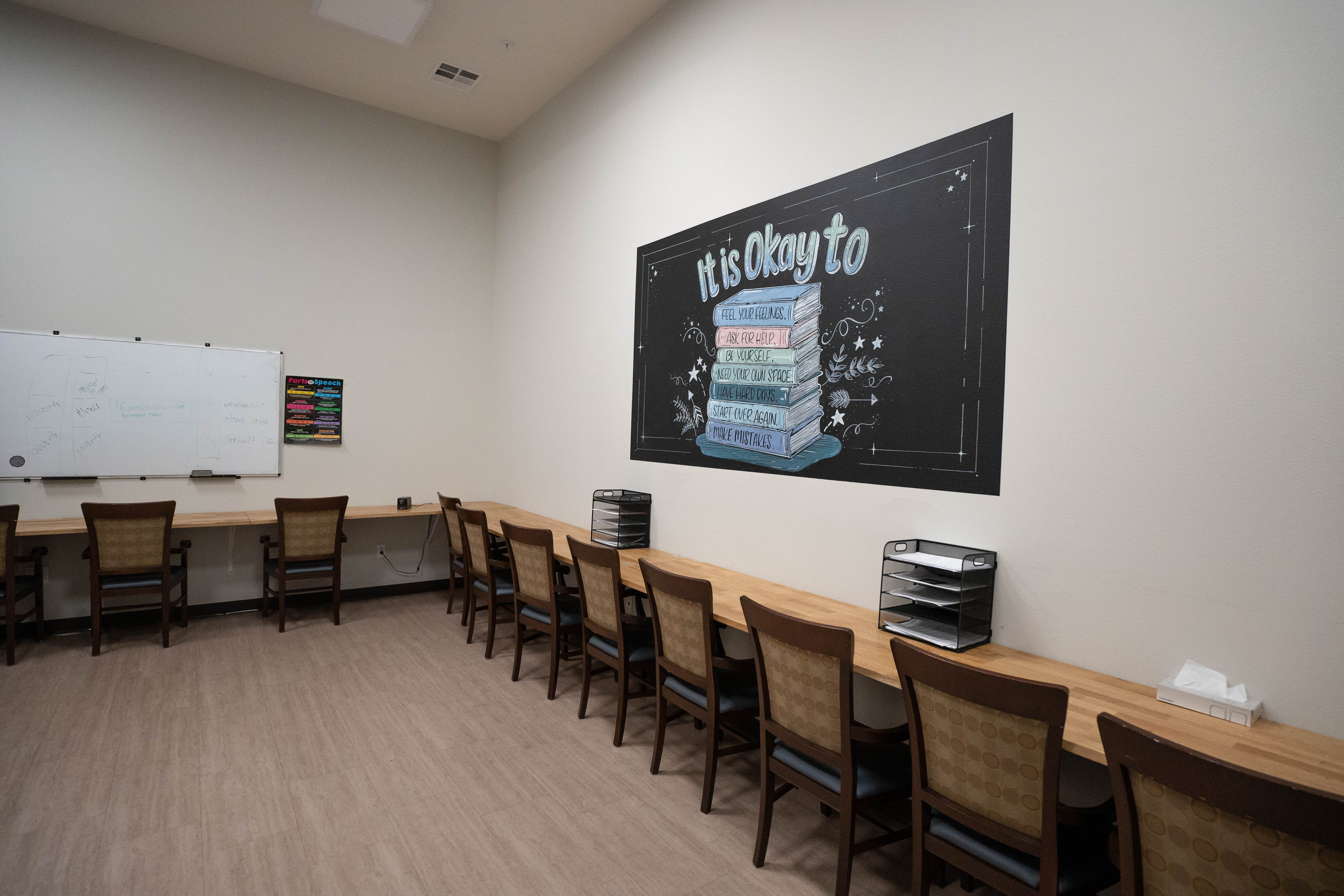 Classroom with whiteboard and student desk chairs