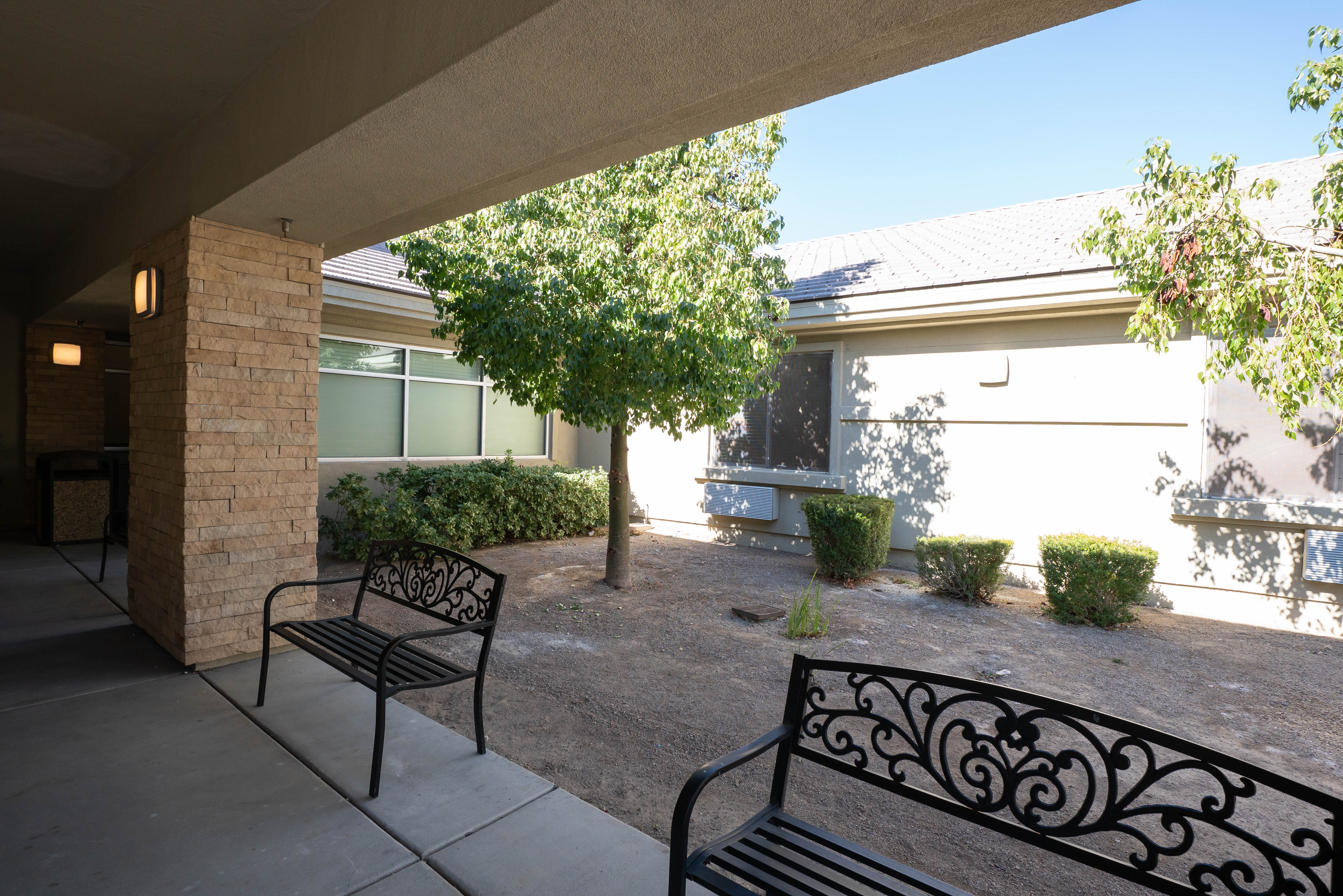 Silver State patio with benches and desert landscaping