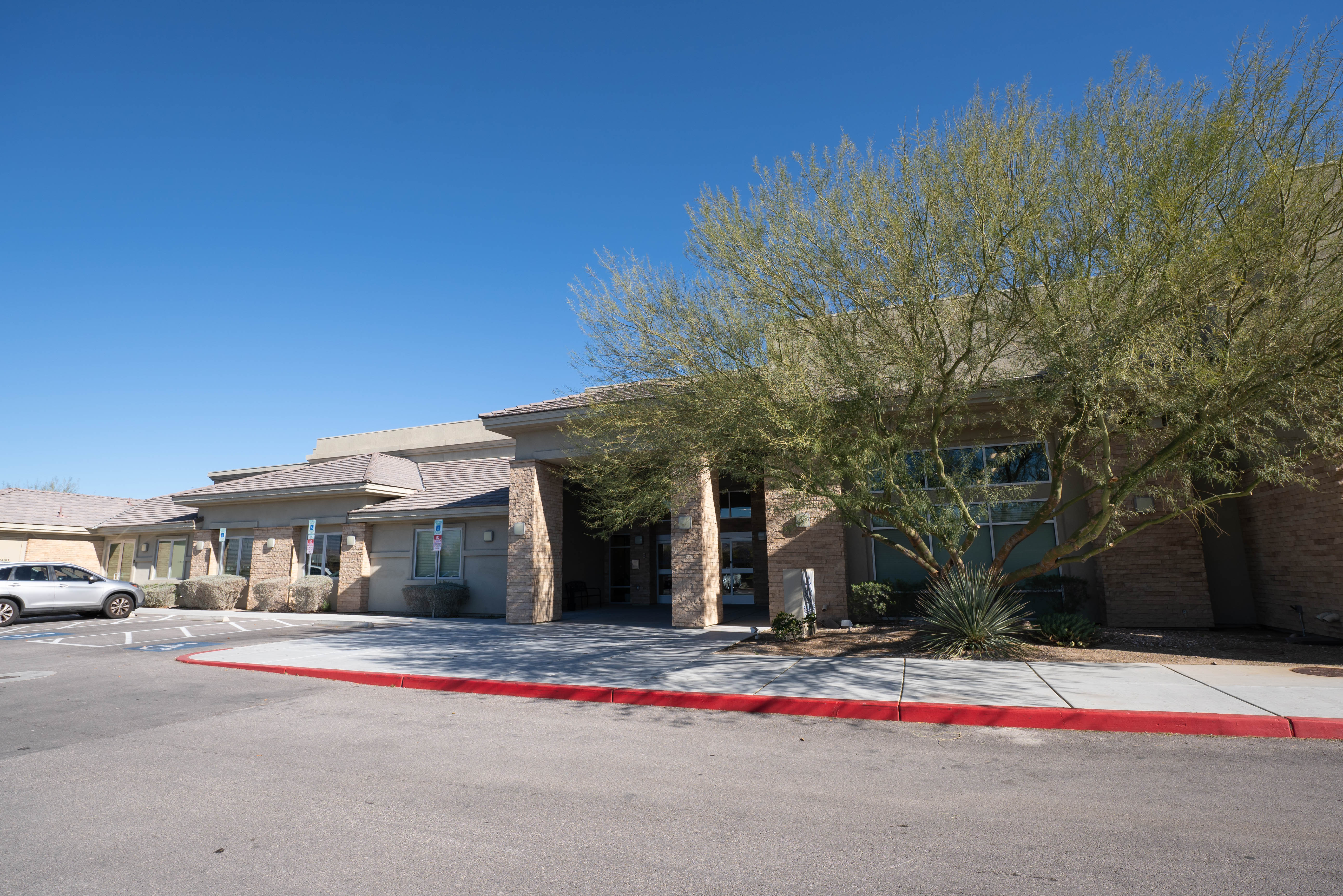 Silver State building wide view with desert landscaping