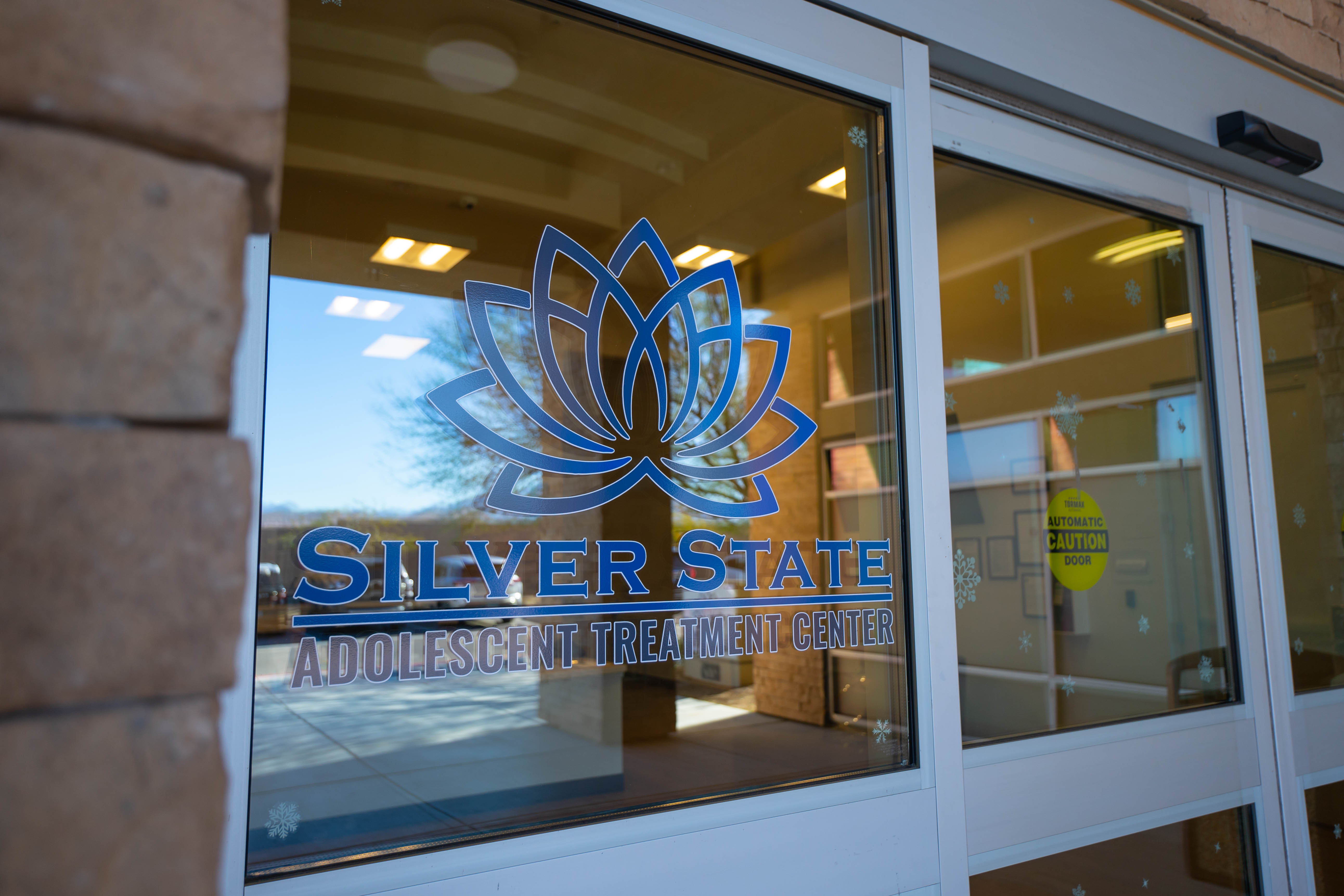 Silver State front door with lotus logo