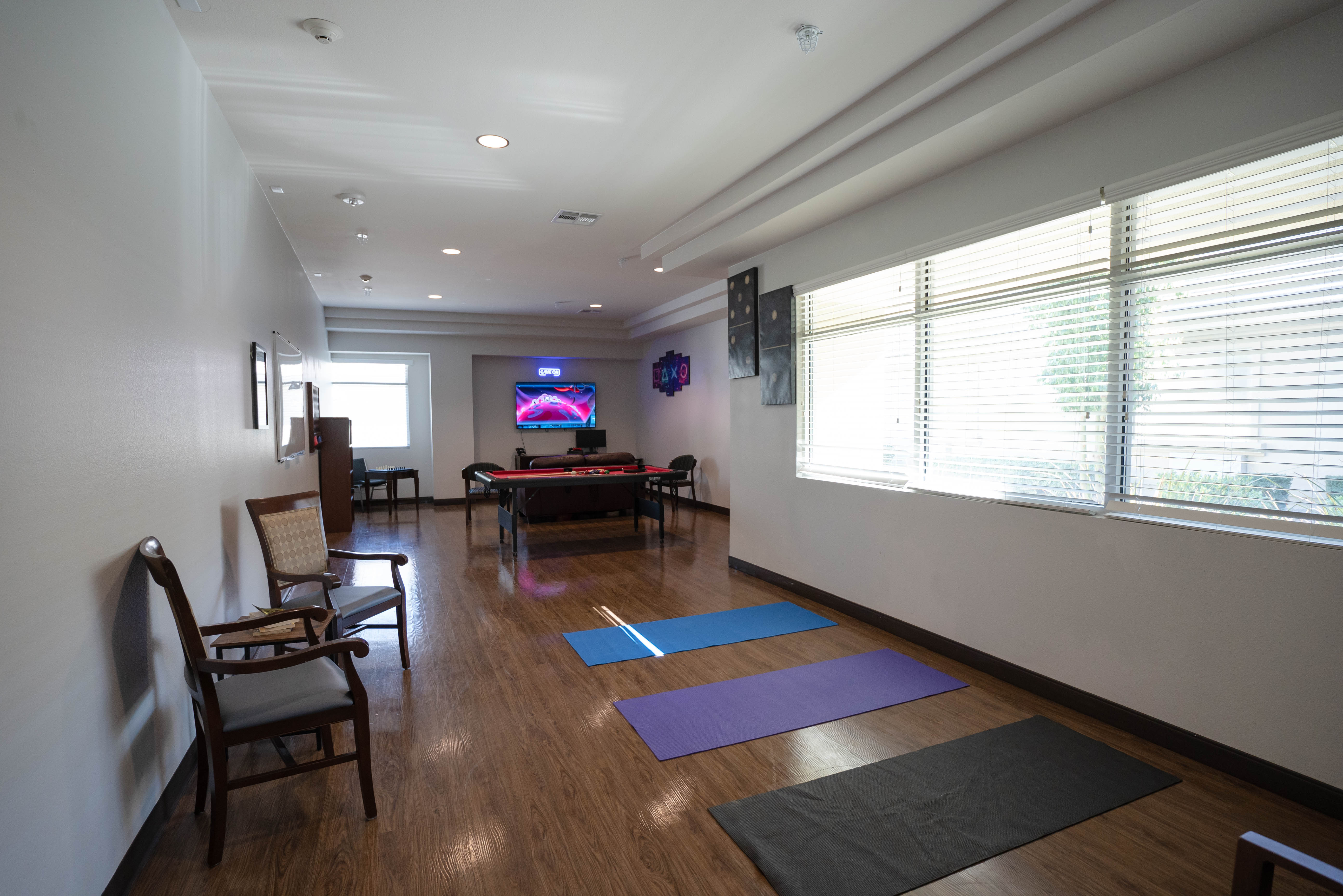 Silver State recreation room with yoga mats and pool table