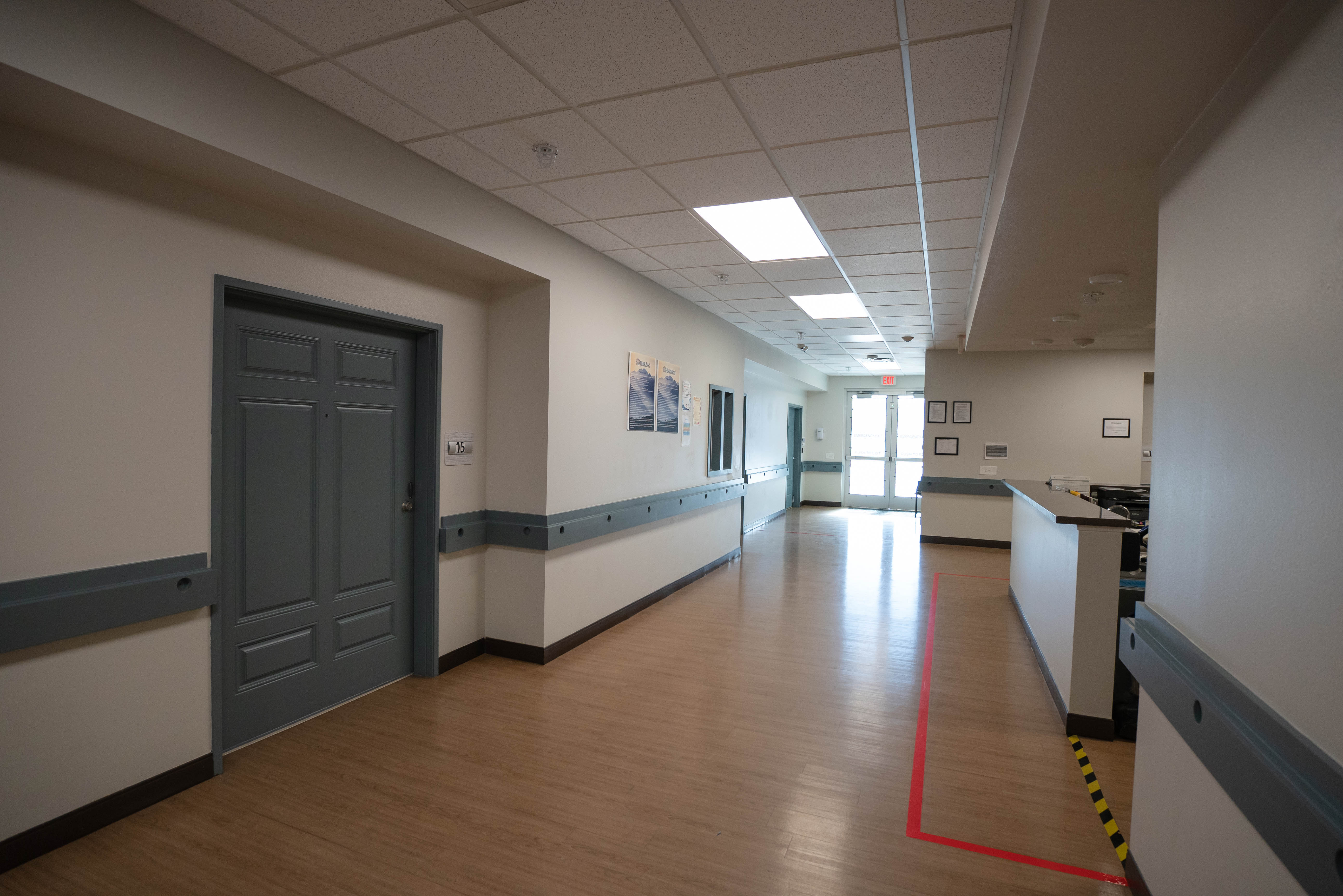 Silver State hallway with nursing station and room doors