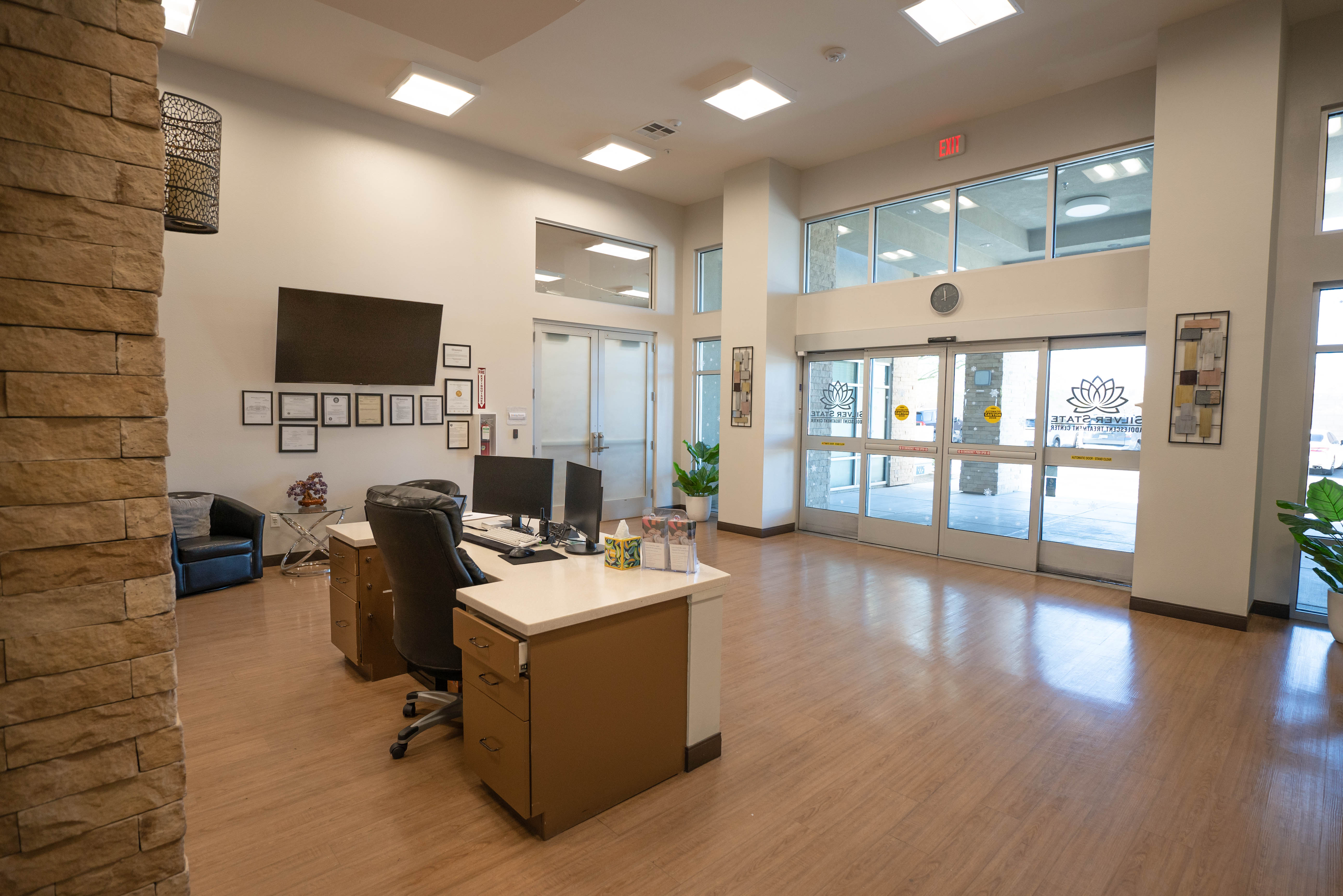 Silver State admin desk with glass entrance doors