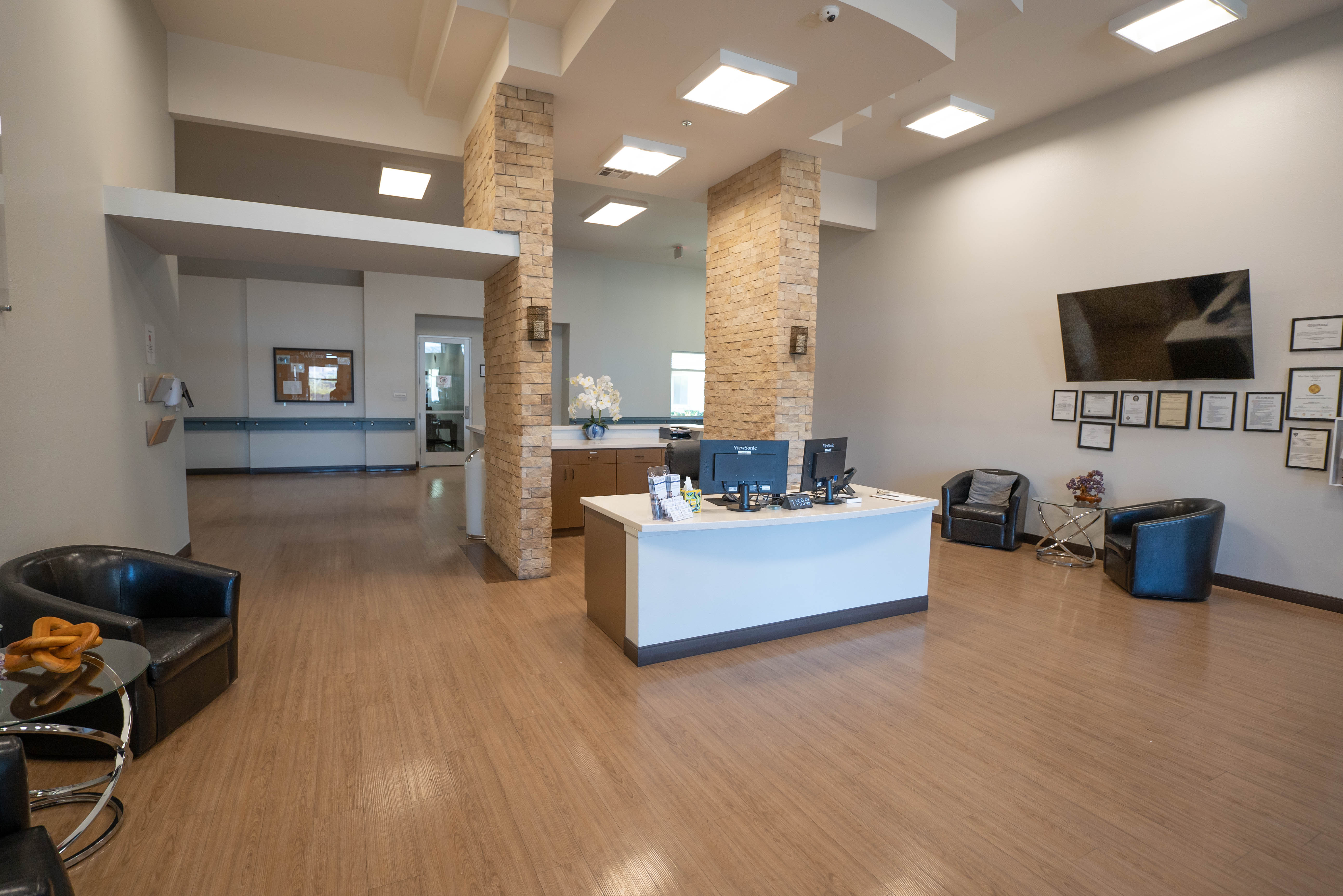 Silver State lobby with wall-mounted TV and licenses